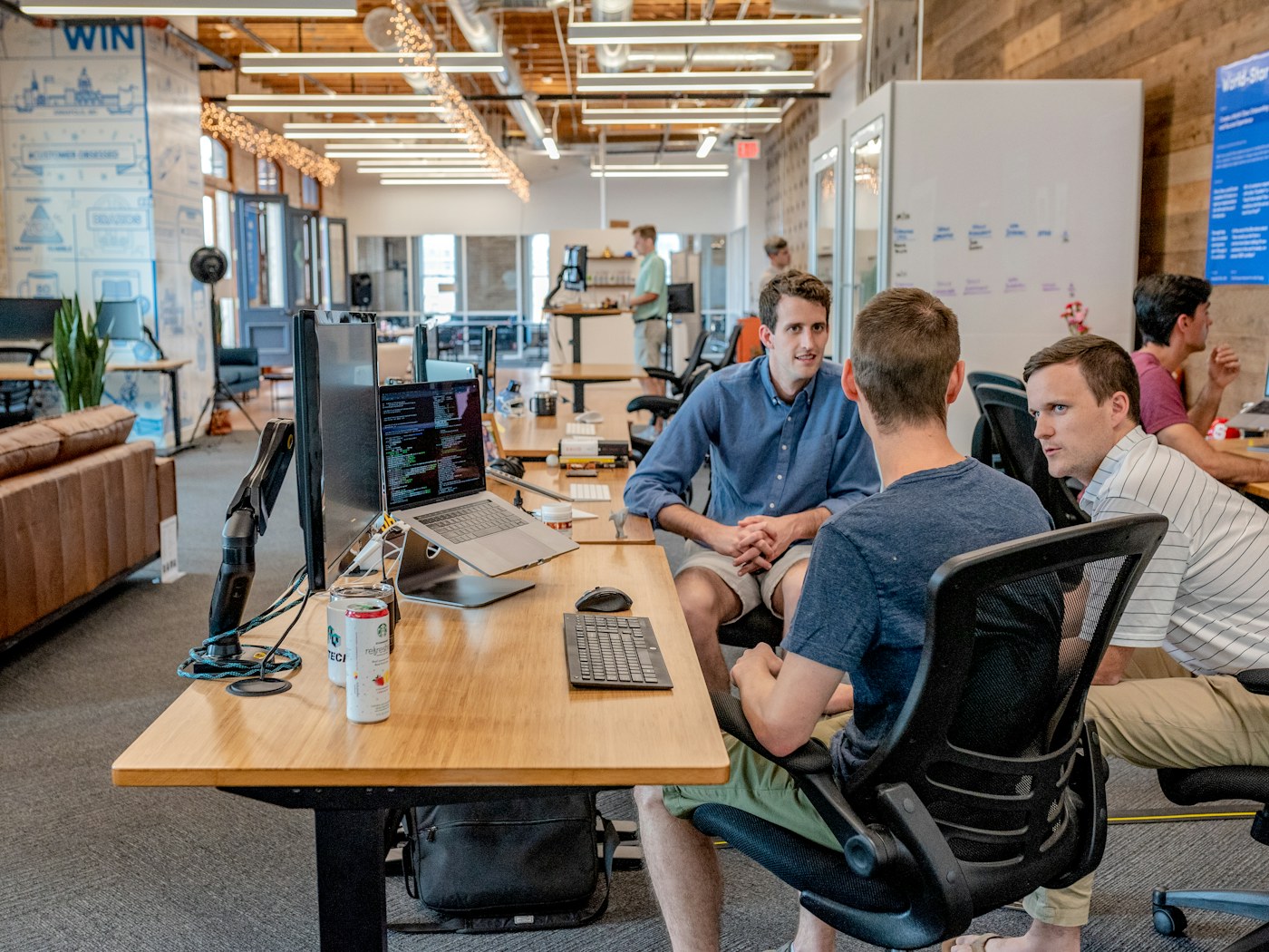 A growth team collaborating around a shared workspace